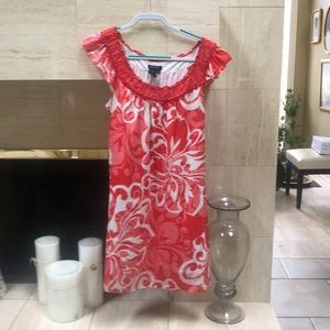 - Coral and cream cotton dress